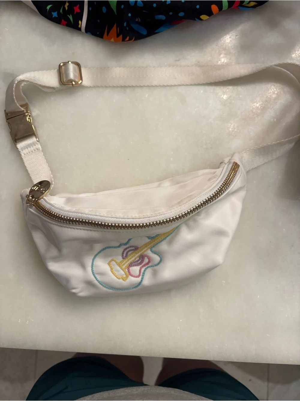 Stoney Clover Lane white pouch with teal, yellow, and pink embroidery